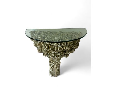 A vintage white painted carved console table in the form of a bunch of roses
With later glass top, the roses tied with a riba