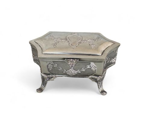 An early 20th century small French silver trinket box 
In the Louis XV style, the shaped hinged lid with cartouche and floral