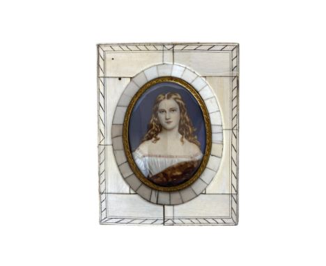 An early 20th century decorative portrait miniature of a young lady in a bone frame
14cm x 11cm including frame