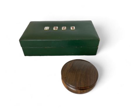 A vintage green leather playing card box and a cocobolo circular box
21cm and 7cm wide respectively. (2)

Provenance:
Propert