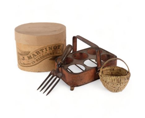 A painted metal bottle holder, 29.5cm across, French cardboard hat box, a basket, and a garden hand fork 