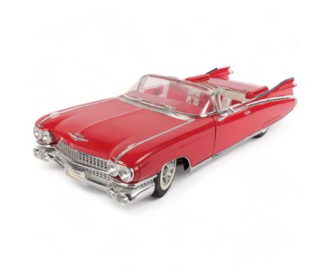 A Maisto 1/12 scale diecast model of a 1959 Cadillac Eldorado Biarritz, in original box and packaging 