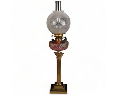 A Victorian Corinthian column oil lamp, with glass shade and font, H77cmThe shade and funnel sit slightly off-centre but not 