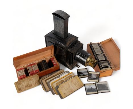 A slide projector with brass mounts, and 2 boxes of glass slides, mainly topographical, and a selection of slides for a stere