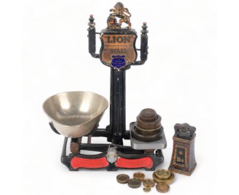 A Victorian "lion" cast-iron balance scale, by Herbert & Sons West Smithfield London, with various Imperial weights, H45cm 