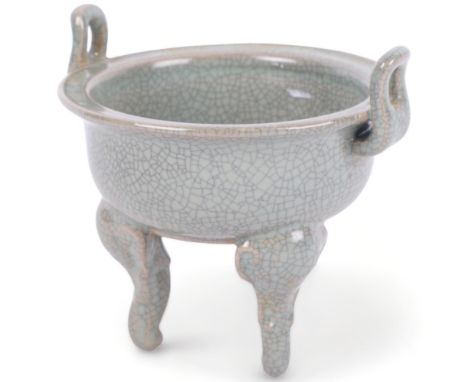 A Chinese celadon crackle glaze censer, on tripod support, 11.5cm across 