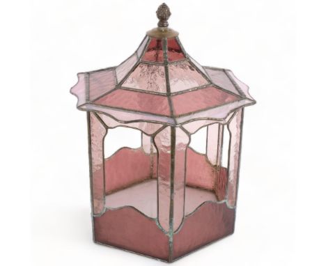 A pink coloured leadlight octagonal terrarium with brass pineapple finial, H41cm, W30cmGenerally good overall condition altho