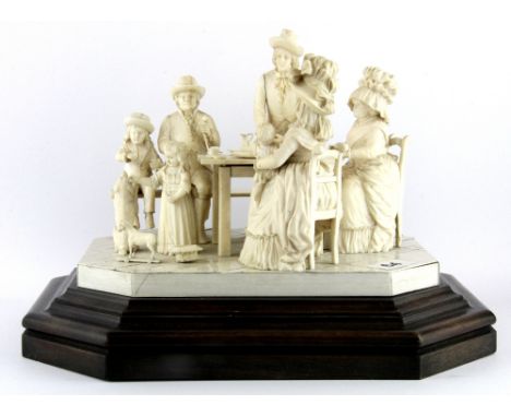 A rare mid 19th Century European carved ivory figure group on an ivory and wood base, overall H. 20cm.