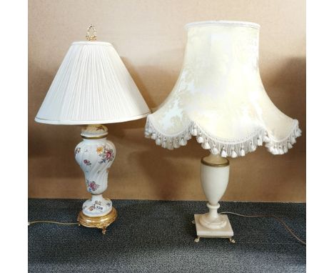 An alabaster table lamp and silk shade, H. 76cm together with an ormolu mounted porcelain table lamp and shade, H. 75cm.