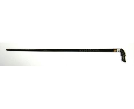 A yellow metal mounted carved ebony dogs head walking stick, handle size 10cm.