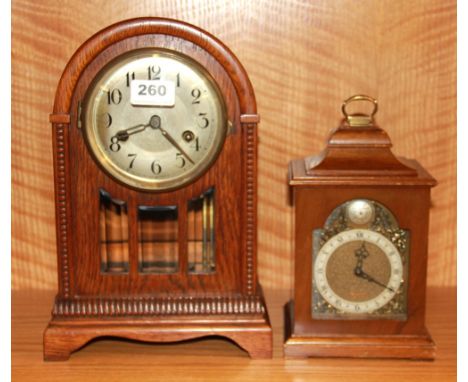 An oak mantle clock and a further mantle clock, both understood to be in W/O, oak clock H. 31cm.