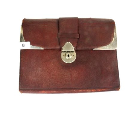 A hallmarked silver mounted leather writing case with ivory accessories, 30 x 24cm.