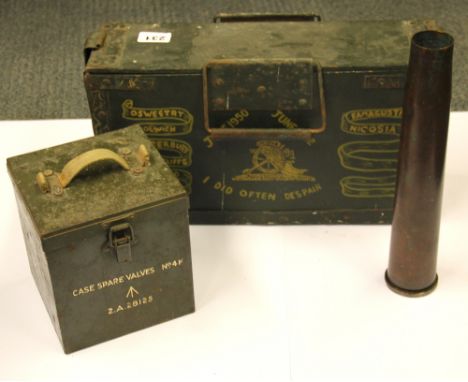 A First World War ammunition case containing a single 36cm shell, together with a "spare valves" case and an unpolished shell