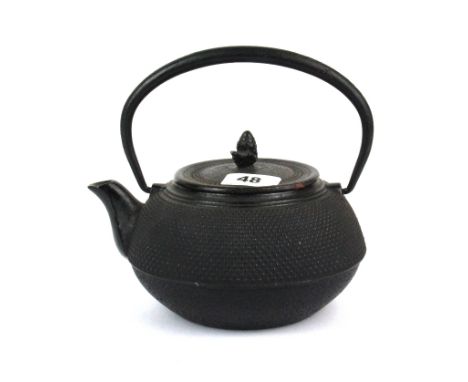 An early 20th Century Chinese cast iron teapot, H. 20cm L. 20cm.
