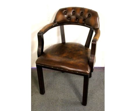 A button backed upholstered gentlemen's chair.
