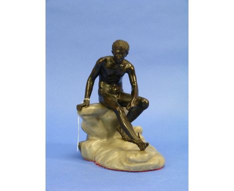 A French patinated bronze figure of Hermes, seated upon a polished stone rock, 7?in (20cm) high.