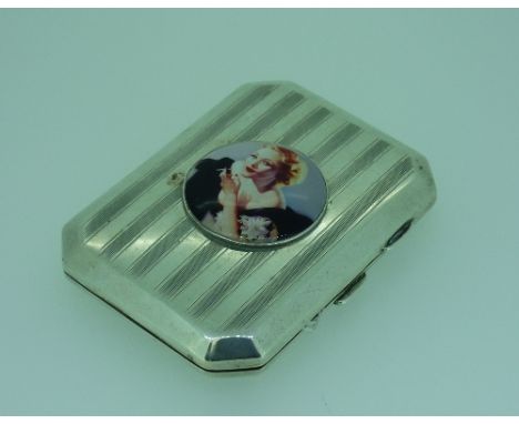 A George V silver Cigarette Case, by James Fenton, hallmarked Birmingham, 1919, of canted rectangular form with engine turned