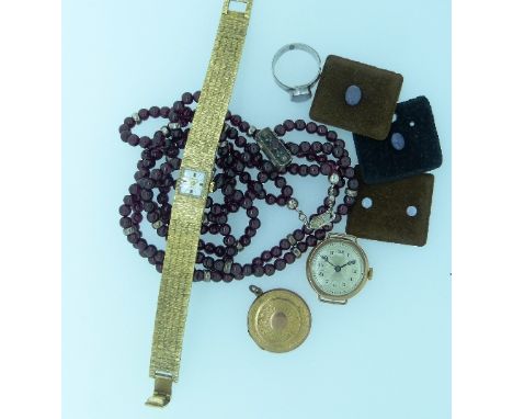 A mixed collection of jewellery, including as double row of garnet beads with silver mounts,  a silver and opal ring, a rolle