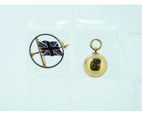 A yellow metal Fob/Charm in the form of a Cricket Ball, one side engraved 'G. Farmington, 1930.31', the other side with a rai