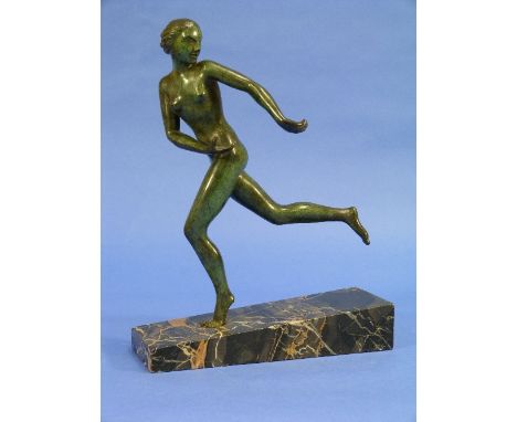 An Art Deco bronze figure of a female nude running, green patinated on a wedge-shaped marbled base, 10?in (27cm) high.