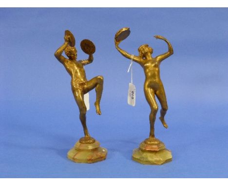 E. Piron, a pair of French Art Deco gilt bronze figures of Bacchanalian dancing musicians, the bases impressed 'E. Piron', on