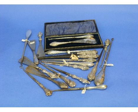 An Edwardian silver-handled Button Hook and Shoe Horn set, hallmarked Chester, 1904, in fitted presentation case, and another