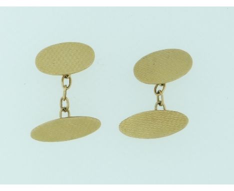 A pair of oval 9ct yellow gold double Cufflinks, with engine turned decoration, with chain between, 6g.