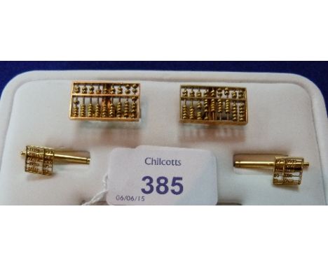 A pair of 14k yellow gold Cufflinks, the fronts formed of an abacus with sliding beads,together with a pair of small matching