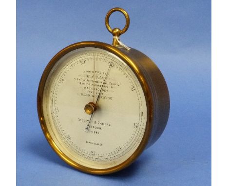 A Victorian Barometer by Negretti & Zambra, no.11380, of brass-cased circular form with suspension ring, the silvered dial in