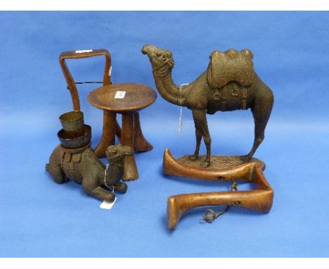 An early 20thC continental carved wood Camel, well carved with saddle, standing on shaped base, 11in (28cm) high, and a simil