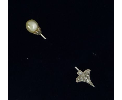 A Jabot Pin; the arrow head with small millegrain set diamond points and with screw fitting for the pin, the finial with larg