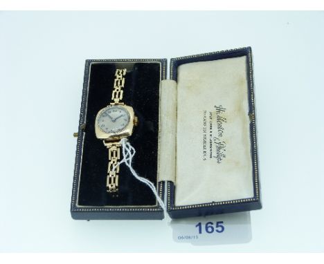 A 9ct gold lady's Wristwatch, with Swiss 17 Jewels movement signed "Vertex Supreme", of cushion form, the circular silvered d
