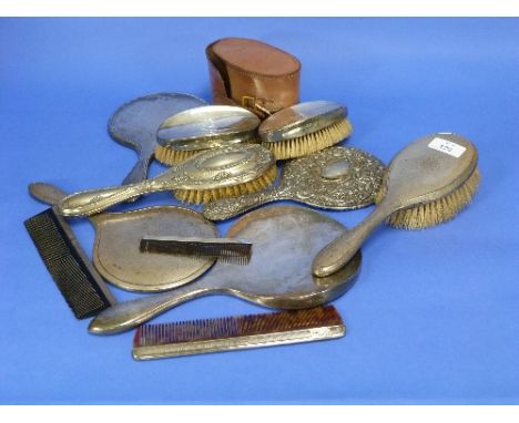 A George V three-piece silver-backed Toilet set, hallmarked Birmingham, 1919, comprising a hand mirror, hair brush and comb, 