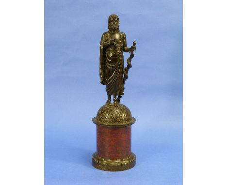 A 19thC bronze figure of Aesculapius with a serpent entwined staff, standing on a domed base and red marbled base, 16?in (41c