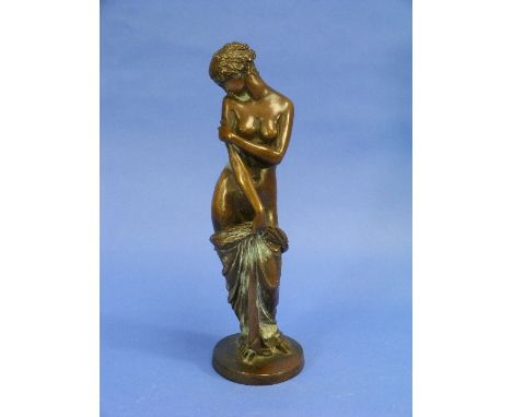 Charles Cumberworth (1811-1852), a bronze figure of a female nude holding robes, signed 'Cumberworth' on the base, 12½in (32c