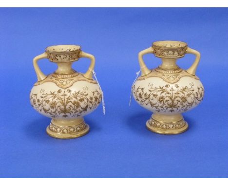 A pair of Victorian Royal Worcester blush ivory Vases, of two-handled squat globular form with pierced borders and gilt folia