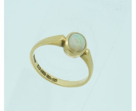 A small 18ct yellow gold Ring, set with oval cabochon opal (stone chipped), Size L.