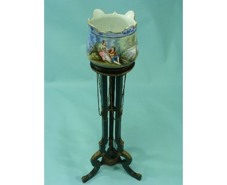 A Louis XVI style ebonised wood Torchere, with gilt-metal mounts, on scroll feet, 85cm (33½in) high, with a ceramic jardinier