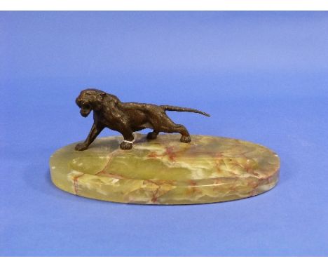 Asprey, an Art Deco-style green marble pen-tray of oval form, surmounted by a bronze Tiger, bears Asprey label on base, 9¾in 