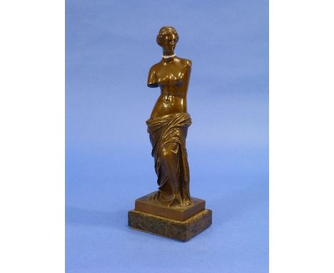 An early 20thC bronze figure of Venus de Milo, on square base and marbled plinth, 9¾in (25cm) high. 