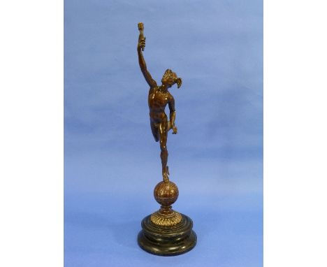 An early 20thC bronze figure of Mercury, the Winged Messenger, in traditional pose, on a globe of the world, on circular ebon