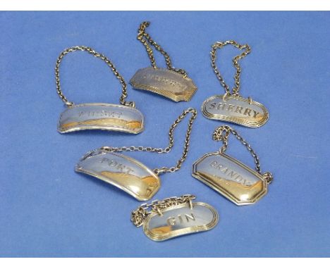 A pair of silver Wine Labels, hallmarked Birmingham, 1964 and 1965, of oval form, incised "Gin" and "Sherry", and two other s