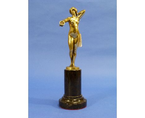 Rudolf Küchler (1867-1954); a gilt bronze figure of a female nude holding a cup, the base marked 'Küchler', o marbled plinth,