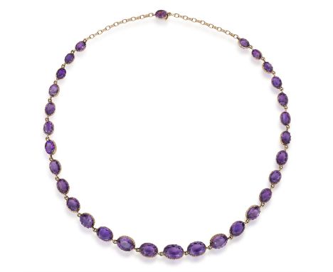 A LATE VICTORIAN AMETHYST RIVIÈRE NECKLACE, CIRCA 1900The graduated oval-shaped amethysts, each mounted in an individual mult