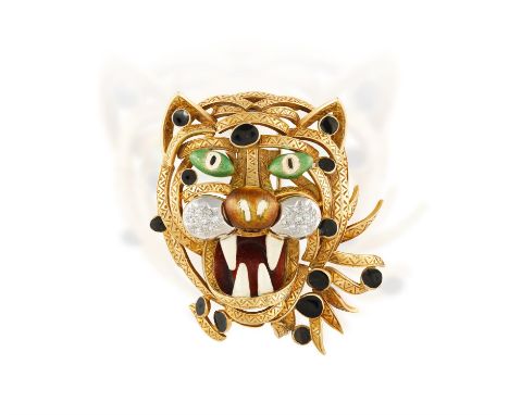 AN ENAMEL AND DIAMOND NOVELTY BROOCH, CIRCA 1970Designed as a tiger's head, the openwork head with chevron engravings through