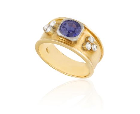 A SAPPHIRE AND DIAMOND RINGThe central cushion-shaped sapphire between a single-cut diamond trip, within raised collet-settin