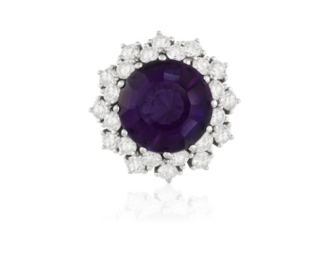 AN AMETHYST AND DIAMOND CLUSTER RINGThe circular mixed-cut amethyst weighing approximately 6.00cts within a surround of brill