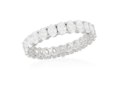 A DIAMOND ETERNITY RINGComposed of a continuous row of oval-shaped diamonds with claw-setting, mounted in 18K gold, diamonds 