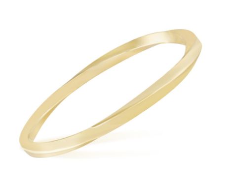A GOLD BANGLE, BY TIFFANY & CO.The polished gold twisted bangle, mounted in 18K gold, signed Tiffany & Co., inner diameter 8.