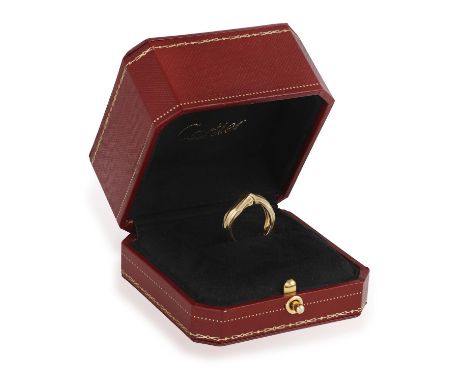 A GOLD 'BAMBOO' RING, BY CARTIER, CIRCA 1995Designed as a tapered row of polished textured bamboo stem, in 18K gold, signed C